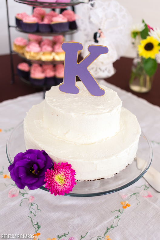 Rustic wedding cake with purple accents