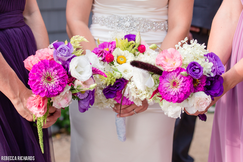 Brightly colored bridesmaid bouquets. Pink, orchid, purple.