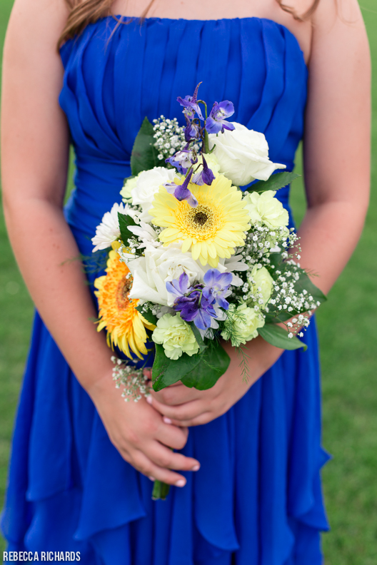 Colbalt blue bridesmaid dress and yellow flowers for bouquet
