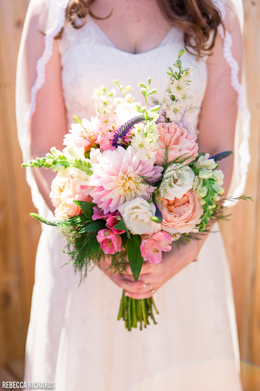 Stunning bridal bouquet. Pastel, pink, coral, soft colors. Maine wedding photographer. 