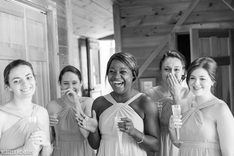 First look with bridesmaids! These bridesmaids had perfect reactions to seeing the bride in her dress for the first time. Rebecca Richards Photography. Maine Wedding Photographer. 
