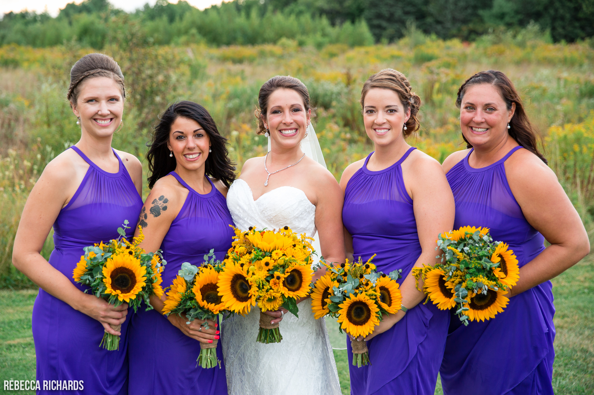 Purple bridesmaids dresses with yellow sunflowers in the fall | Outdoor Maine Wedding