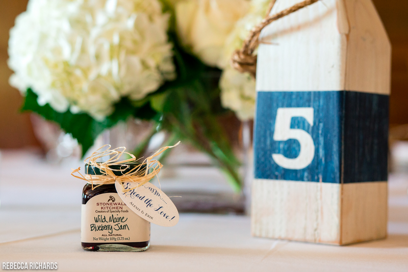 Reclaimed lobster buoy for table number and blueberry jam favors | unique Maine wedding trend idea